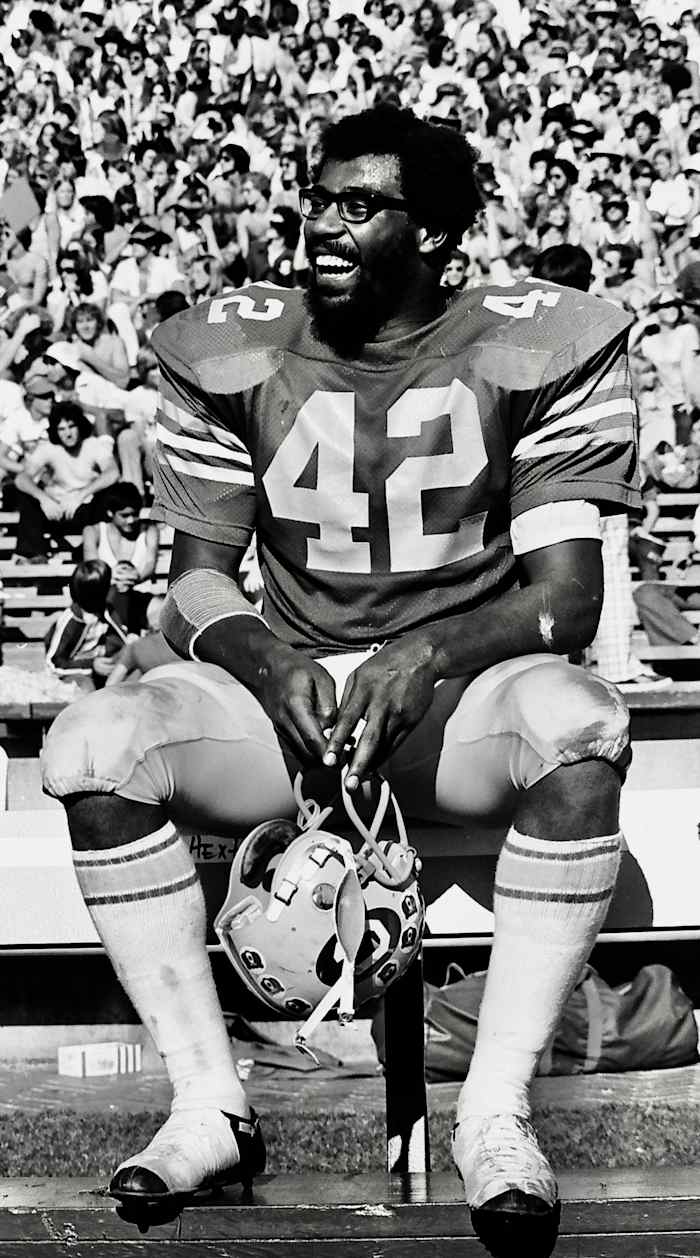 Chuck Muncie enjoys a happy sideline moment with Cal
